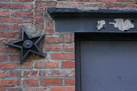 do metal stars on houses mean anything|cast iron stars on buildings.